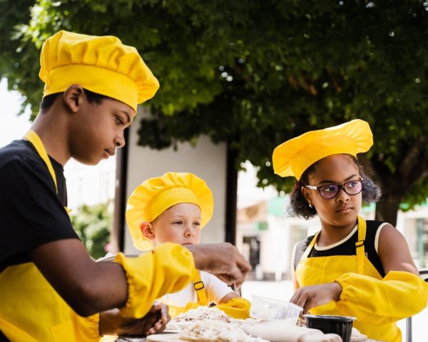 Happy,Company,Of,Multiethnic,Children,Cooking,Dough.,Childhood,Cook,Activity